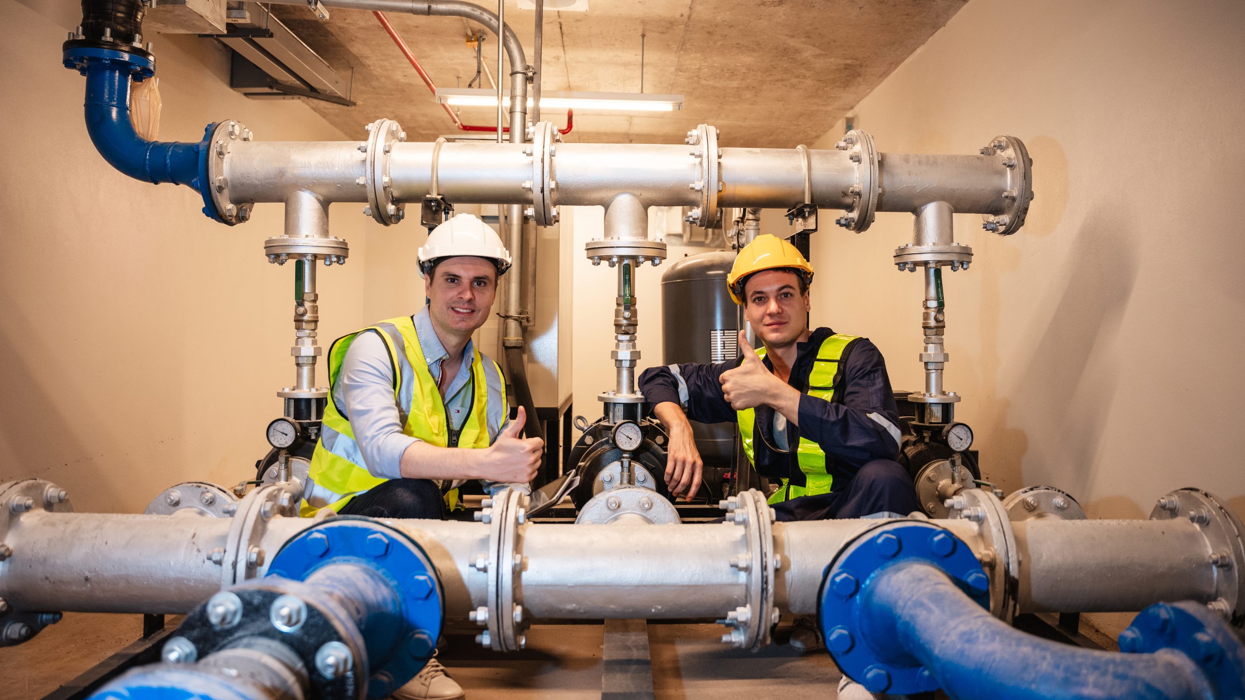 portrait-of-engineers-inspecting-the-inside-plumbi-2025-03-14-00-52-01-utc.jpg